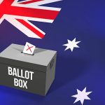 Casting a vote in a black ballot box for an election in Australia