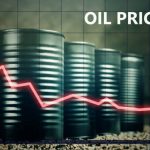 Few barrels of oil and a red graph down – decline in oil prices concept.