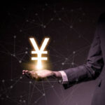 Yen symbol floating on woman’s hand